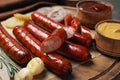 Delicious grilled sausages and vegetables on grey , closeup Royalty Free Stock Photo