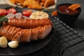 Delicious grilled sausages and  on grey table, closeup Royalty Free Stock Photo