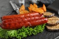 Delicious grilled sausages and vegetables on  table, closeup Royalty Free Stock Photo
