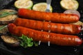 Delicious grilled sausages and    in grill pan, closeup Royalty Free Stock Photo