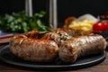 Delicious grilled sausages on table, closeup Royalty Free Stock Photo