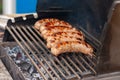 Delicious grilled sousages. Barbiquing sousages on hot grill