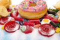 Delicious group of sweet sugar donut cakes and lots of gummy can Royalty Free Stock Photo