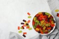 Delicious gummy bear candies on table, flat lay. Space for text