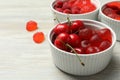 Delicious gummy candies and fresh fruits on white wooden table, closeup. Space for text Royalty Free Stock Photo
