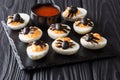 Delicious Halloween appetizer: deviled eggs decorated with olive