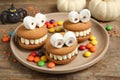 Delicious Halloween themed desserts on wooden table