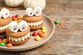 Delicious Halloween themed desserts on wooden table Royalty Free Stock Photo