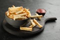 Delicious hard chucks in bowl on black table