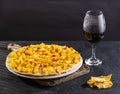 Delicious Hawaiian pizza with pineapple, ham and mozzarella - Wine glass Royalty Free Stock Photo