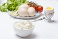 Delicious and healthy breakfast.Cottage cheese,boiled eggs and various of vegetables.The morning table Royalty Free Stock Photo