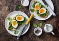 Delicious healthy breakfast - grilled bread sandwich with spinach and boiled eggs on wooden background Royalty Free Stock Photo