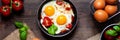 Delicious and healthy breakfast for one person: small pan with 2 fried eggs with vegetables and cheese. Served on a dark wooden