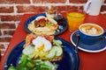 Delicious healthy brunch with avocado and salmon toast, boiled egg, pancakes with fruits and maple syrup Royalty Free Stock Photo