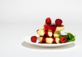 Delicious and healthy cottage cheese pancakes on a white saucer, poured with BlackBerry jam Royalty Free Stock Photo