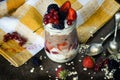 Delicious and healthy dessert of berries with yogurt and muesli