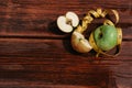 Delicious and healthy food for healthy and active people. One whole green Apple and a red Apple cut into pieces lie on the wooden Royalty Free Stock Photo