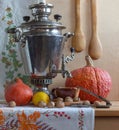 Still life with a Russian samovar and pumpkins. Royalty Free Stock Photo