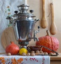 Still life with a Russian samovar and pumpkins. Royalty Free Stock Photo