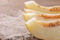 Delicious, healthy, fresh melon slices on a black table