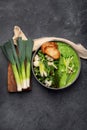 Delicious healthy green cream soup in a bowl with croutons on table Royalty Free Stock Photo