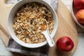 Homemade granola with oats, puffed amaranth, quinoa, almonds, dried fruits in a bowl