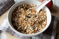 Homemade granola with oats, puffed amaranth, quinoa, almonds, dried fruits in a bowl