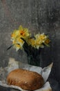 delicious and healthy homemade whole grain bread with honey. place for text. yellow flowers in the background