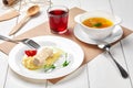Kids set lunch of vegetable soup, mashed potatoes with chicken patty, berry compote Royalty Free Stock Photo