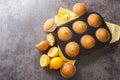 Delicious healthy muffins with poppy seeds and lemon zest close-up in a metal muffin pan. horizontal top view Royalty Free Stock Photo