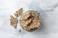 Delicious healthy multigrain gluten-free crackers, ketogenic, from chia seeds, flax, sesame and ground pumpkin seeds in a glass Royalty Free Stock Photo