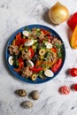 delicious and healthy Nicoise salad, top view on a white background