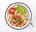 Delicious and healthy oatmeal with figs, nuts, kiwi and seeds