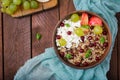 Delicious and healthy oatmeal with grapes, nuts, apples and cottage cheese Royalty Free Stock Photo