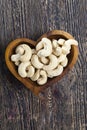 cashew nuts in a heart-shaped plate Royalty Free Stock Photo