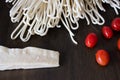 Uncooked ingredients of italian pasta with tomato and parmesan cheese