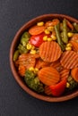 Delicious healthy vegetables steamed carrots, broccoli, asparagus beans and peppers Royalty Free Stock Photo