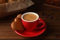 Delicious heart shaped cookies and cup of coffee on wooden table, closeup Royalty Free Stock Photo