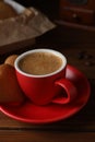 Delicious heart shaped cookies and cup of coffee on wooden table, closeup Royalty Free Stock Photo