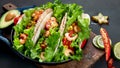 Hispanic mexican food, meat tacos with shrimps on dark background Royalty Free Stock Photo