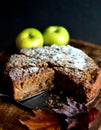 Homemade apple and sultana cake, cut and served with the filling visible.
