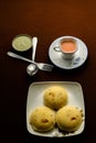 Rava idli with chutney and Tea on the table