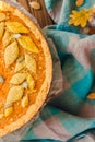 Delicious homemade autumn pumpkin pie and blue tabble cloth