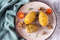 Delicious homemade baked hasselback potatoes with garlic and rosemary on a plate. Top view. Closeup Royalty Free Stock Photo