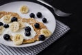 Delicious homemade breakfast with pancakes at black stone background Royalty Free Stock Photo