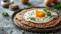 Delicious homemade buckwheat galette topped with a fried egg and fresh parsley a perfect breakfast!