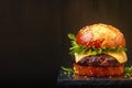 Delicious homemade burger captured in captivating dark background banner Royalty Free Stock Photo