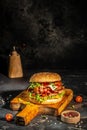 delicious homemade burgers of beef, cheese and vegetables on a wooden board, Hamburger. Fast food concept Royalty Free Stock Photo