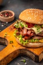 delicious homemade burgers of beef, cheese and vegetables on a wooden board, Hamburger. Fast food concept Royalty Free Stock Photo