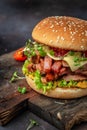 delicious homemade burgers of beef, cheese and vegetables on a wooden board, Hamburger. Fast food concept Royalty Free Stock Photo